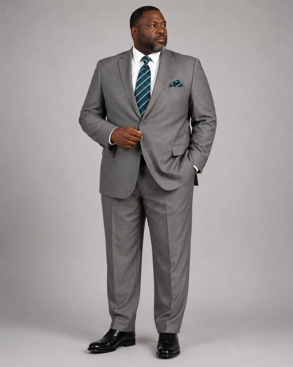 Model wearing gray Super 200’s wool extended size suit from The Third Gentleman