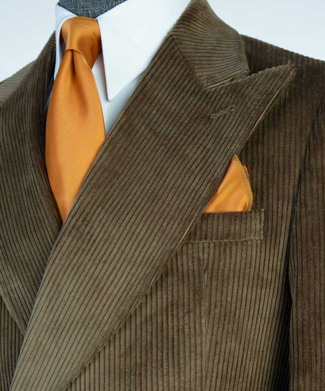 Olive ribbed velvet suit peak lapel and breast-pocket detail