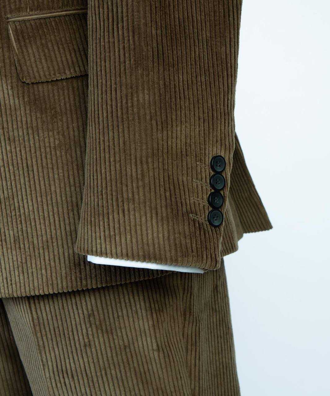 Olive ribbed velvet suit sleeve buttons and pocket detail