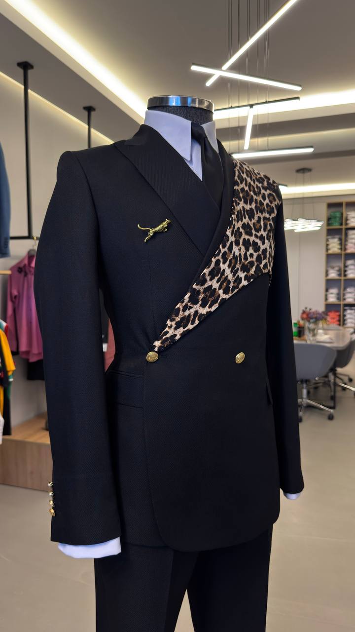 Black leopard-panel double-breasted suit on boutique mannequin