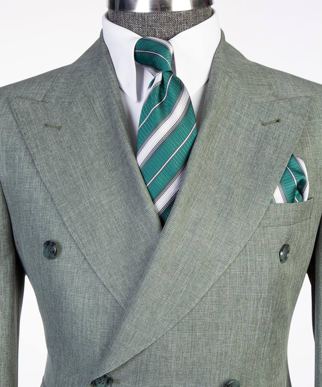 Light gray double-breasted suit lapel tie and pocket square close-up