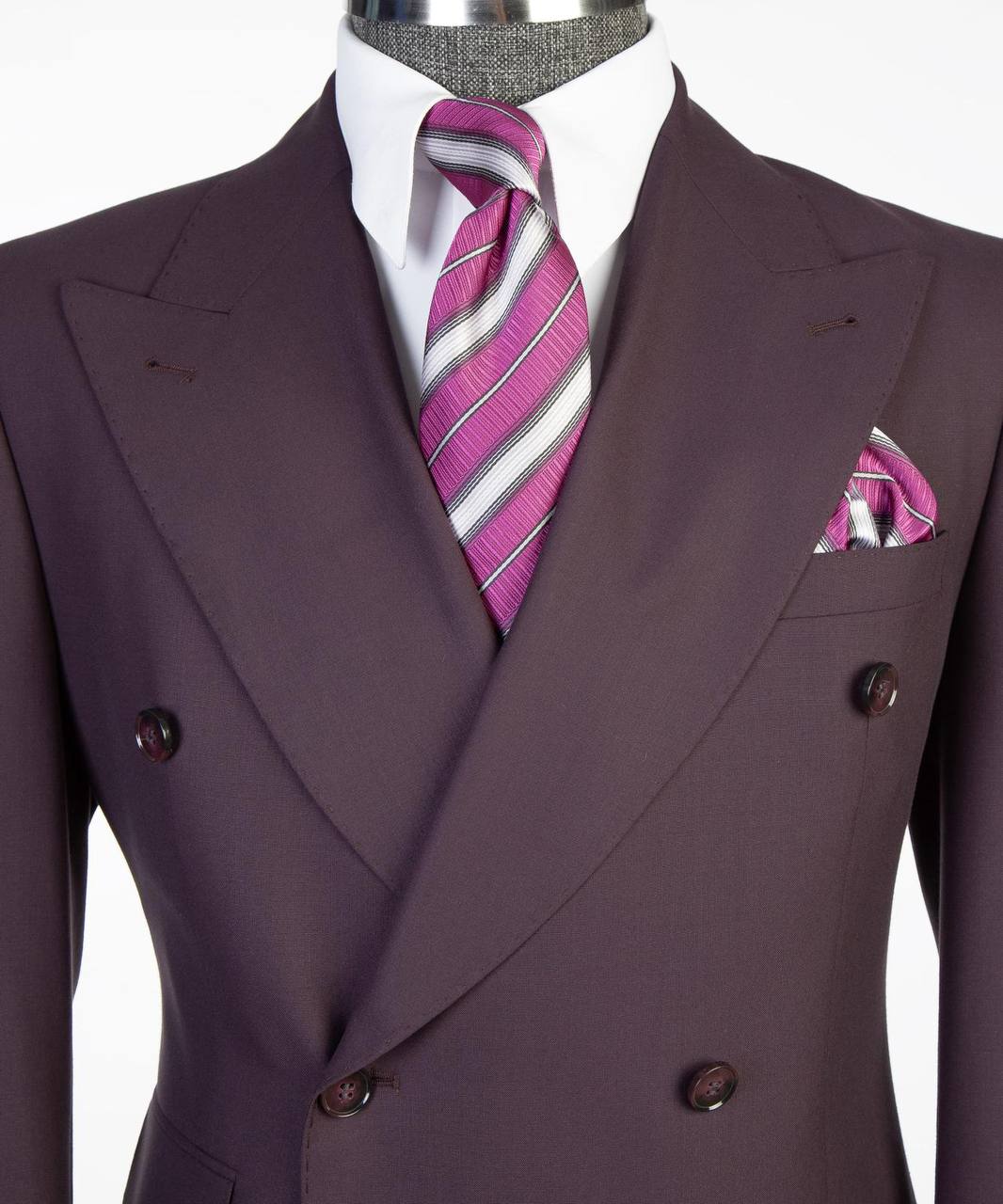 Deep plum double-breasted suit lapel tie and pocket square close-up