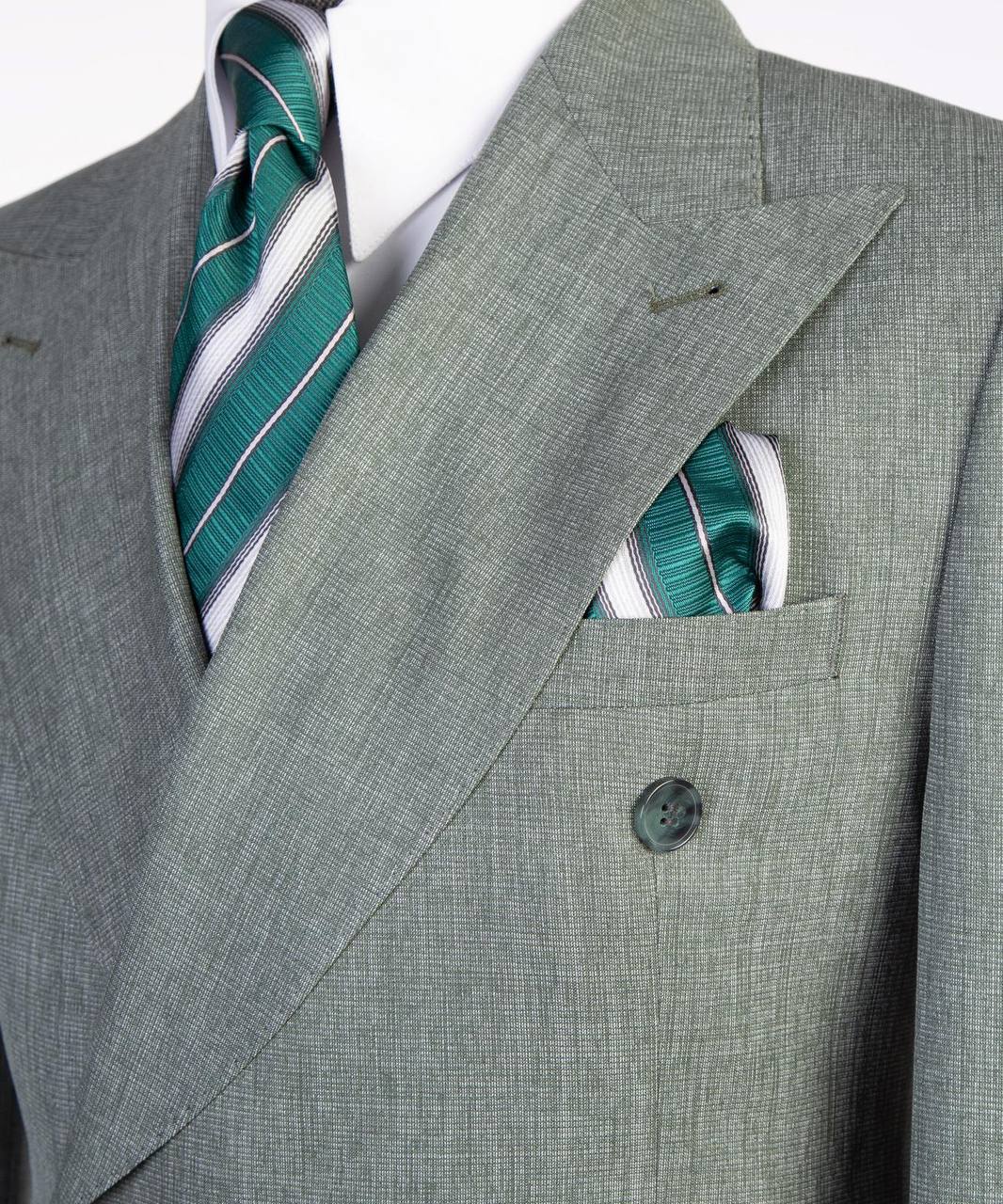 Light gray double-breasted suit upper torso and pocket square detail
