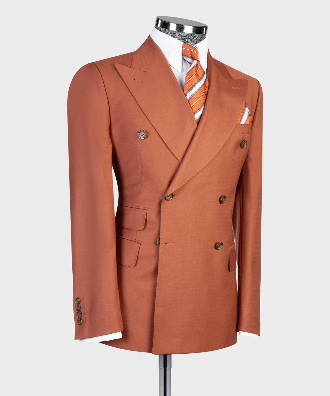 Rust orange double-breasted suit jacket and pocket square detail