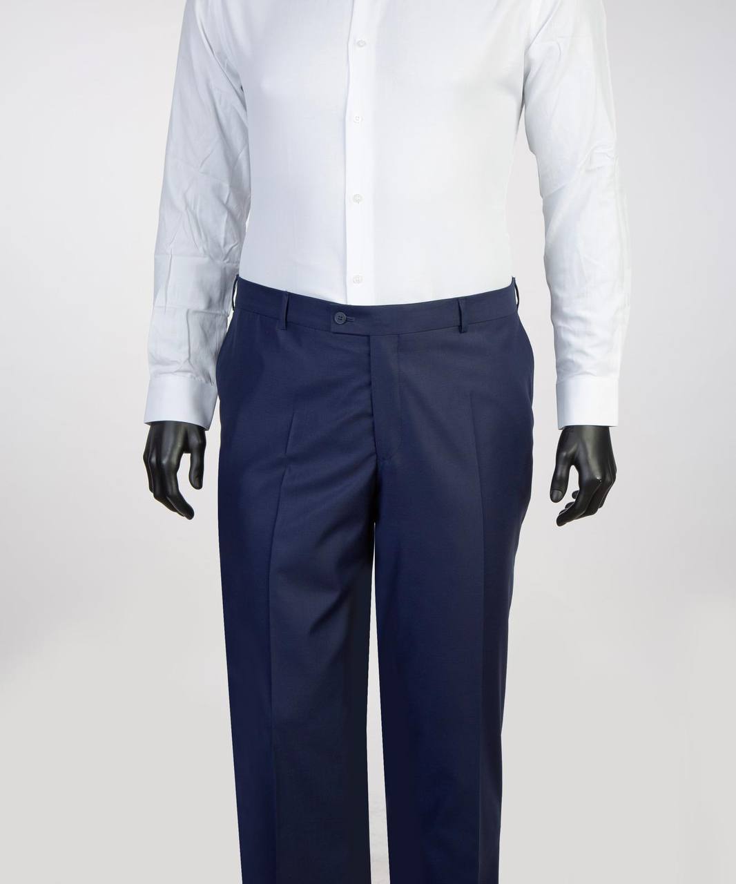Navy suit trousers styled with white dress shirt