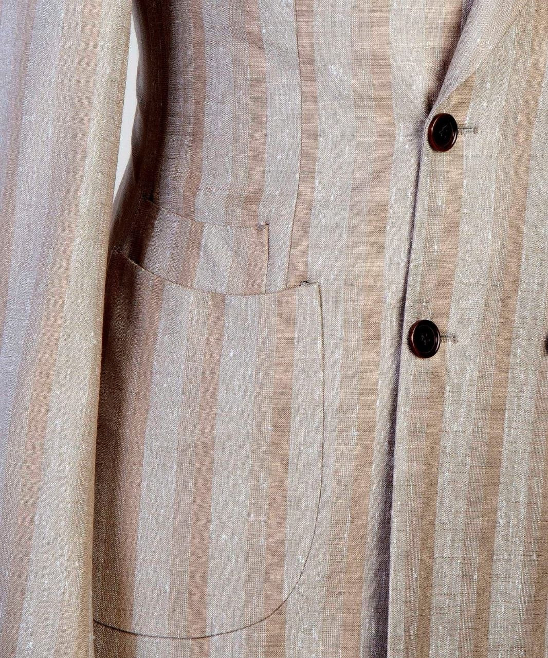 Close-up of champagne stripe 100% linen suit fabric, buttons, and pocket detail