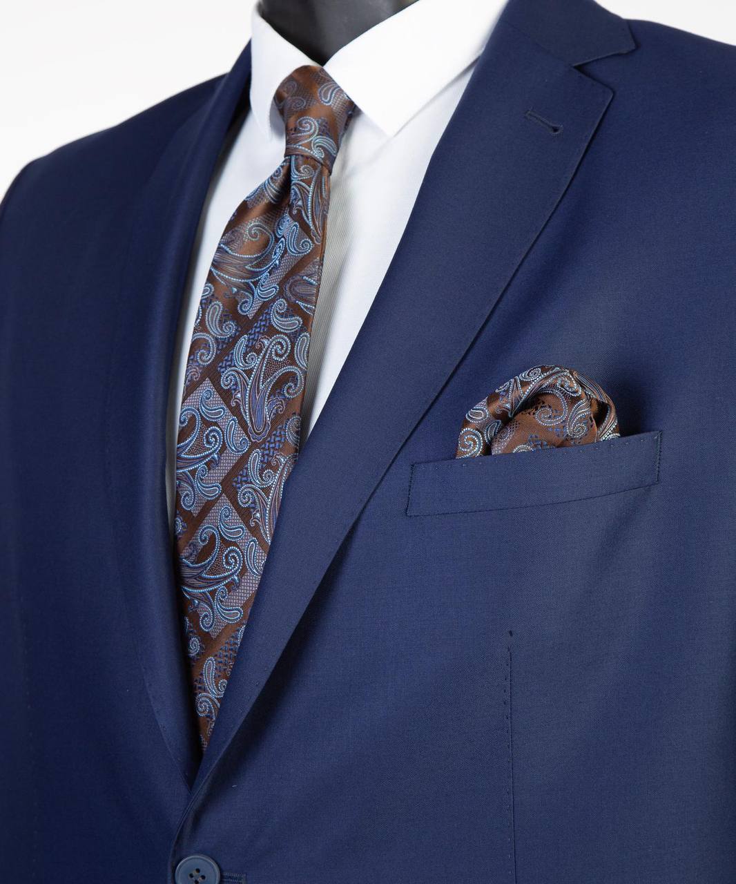 Close-up of navy Super 200’s wool suit jacket with paisley tie styling