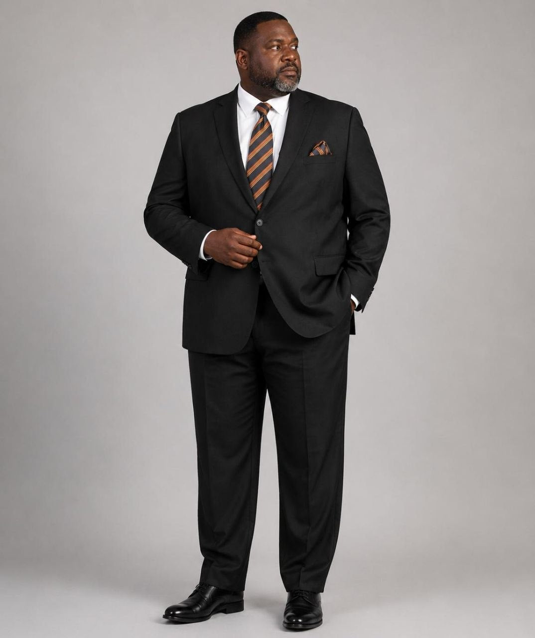 Model wearing black Super 200’s wool extended size suit from The Third Gentleman