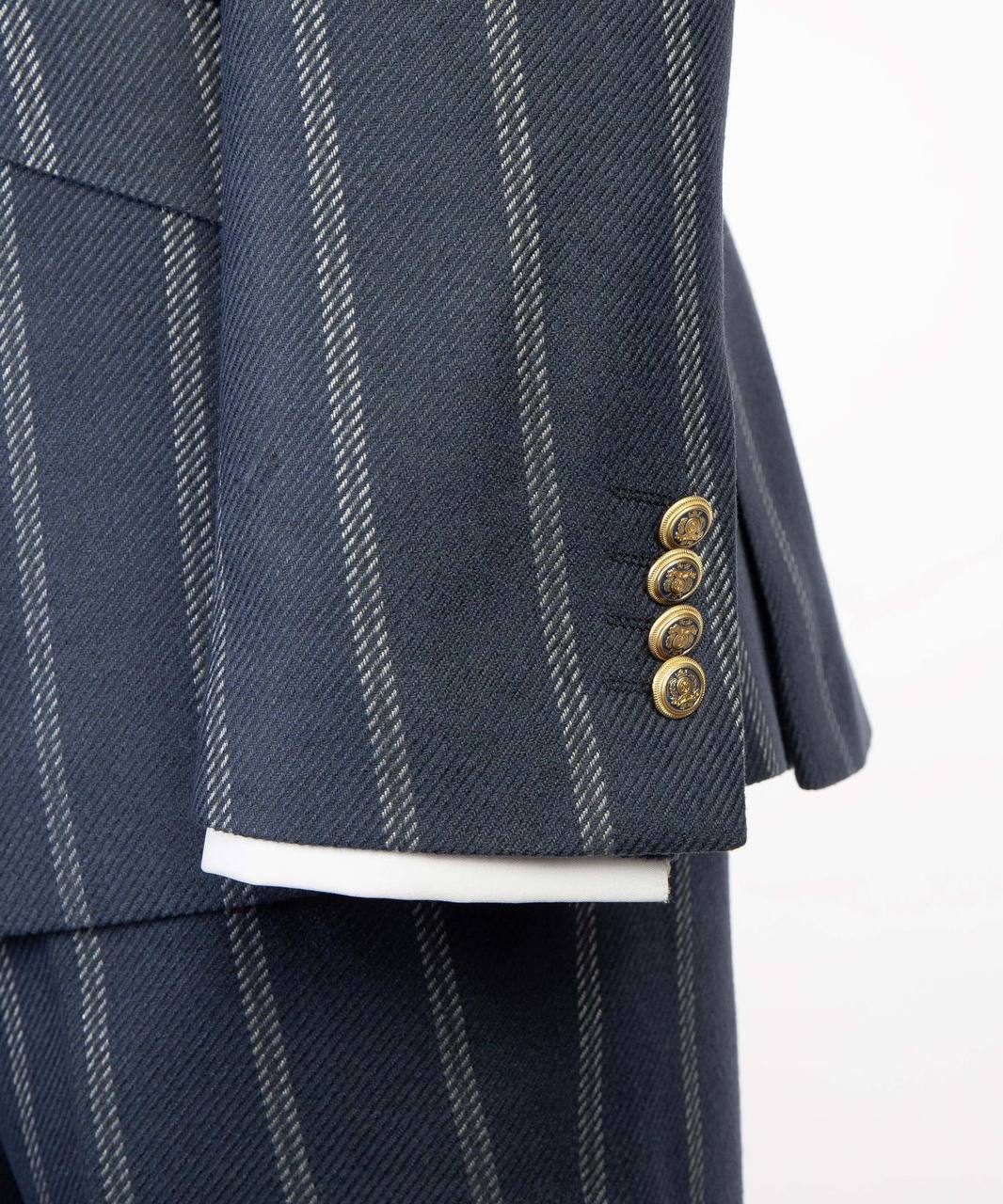 Navy pinstripe double-breasted suit with gold buttons from The Third Gentleman, cuff detail