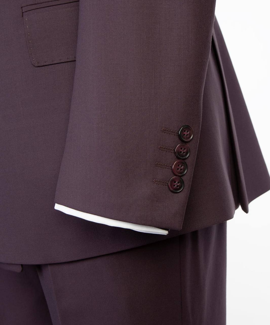 Deep plum suit sleeve cuff and button detail