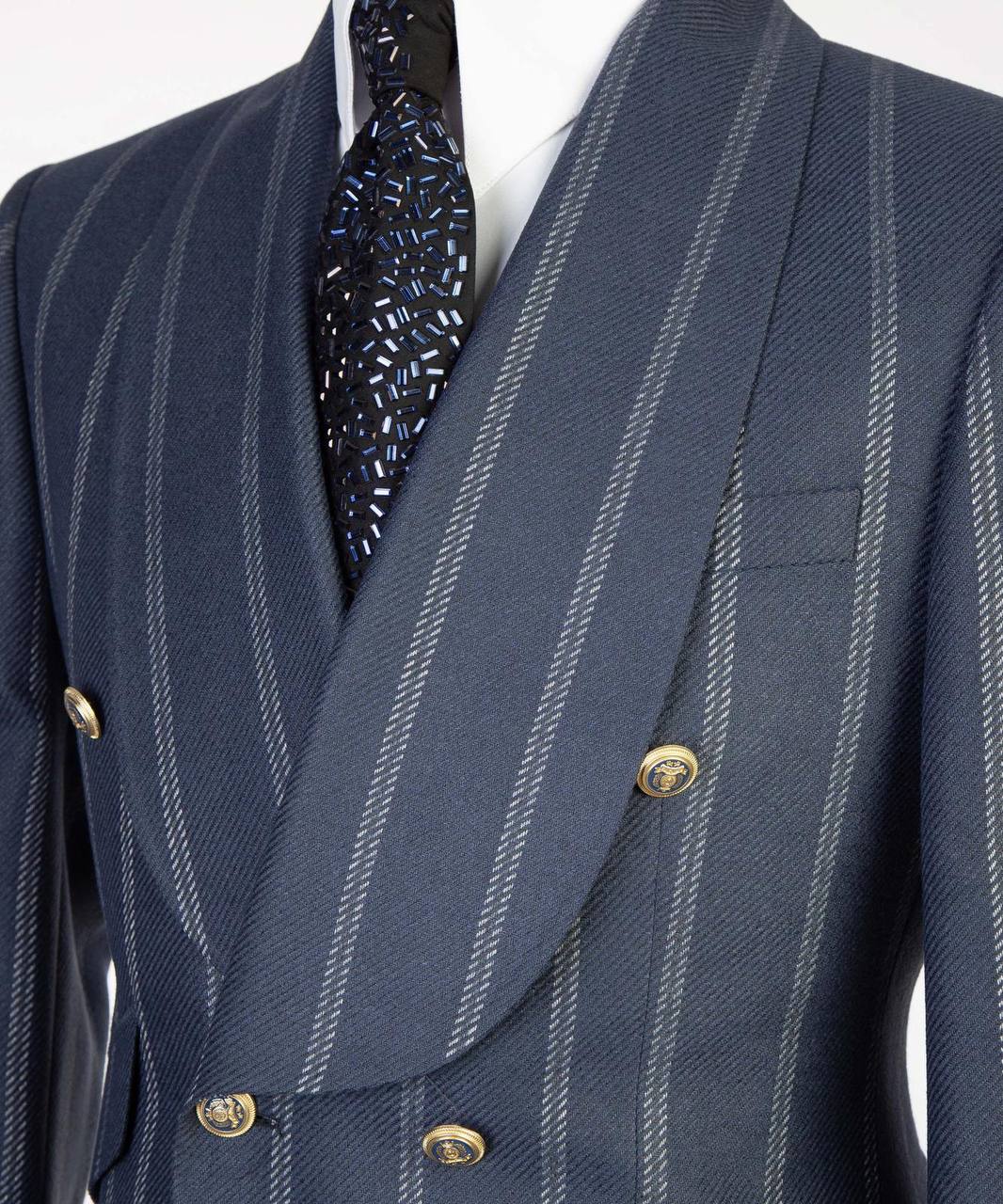 Navy pinstripe double-breasted suit with gold buttons from The Third Gentleman, lapel detail