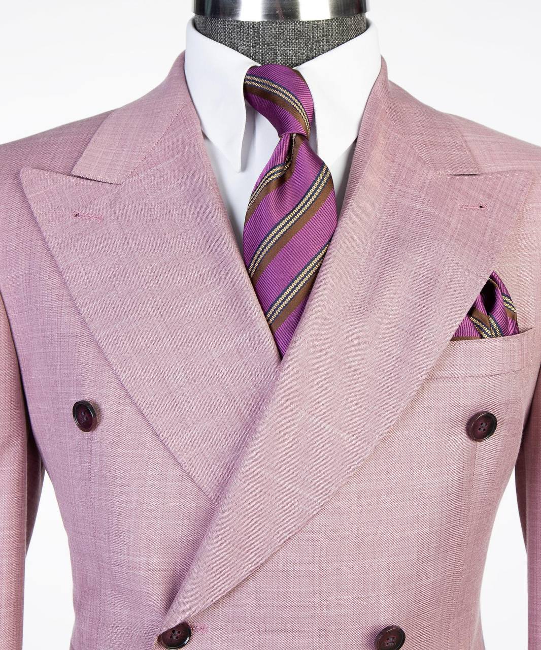 Soft pink double-breasted suit lapel tie and pocket square close-up