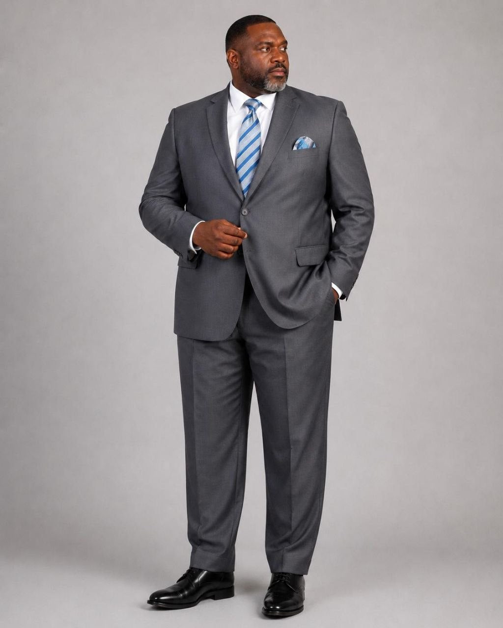 Model wearing charcoal Super 200’s wool extended size suit from The Third Gentleman