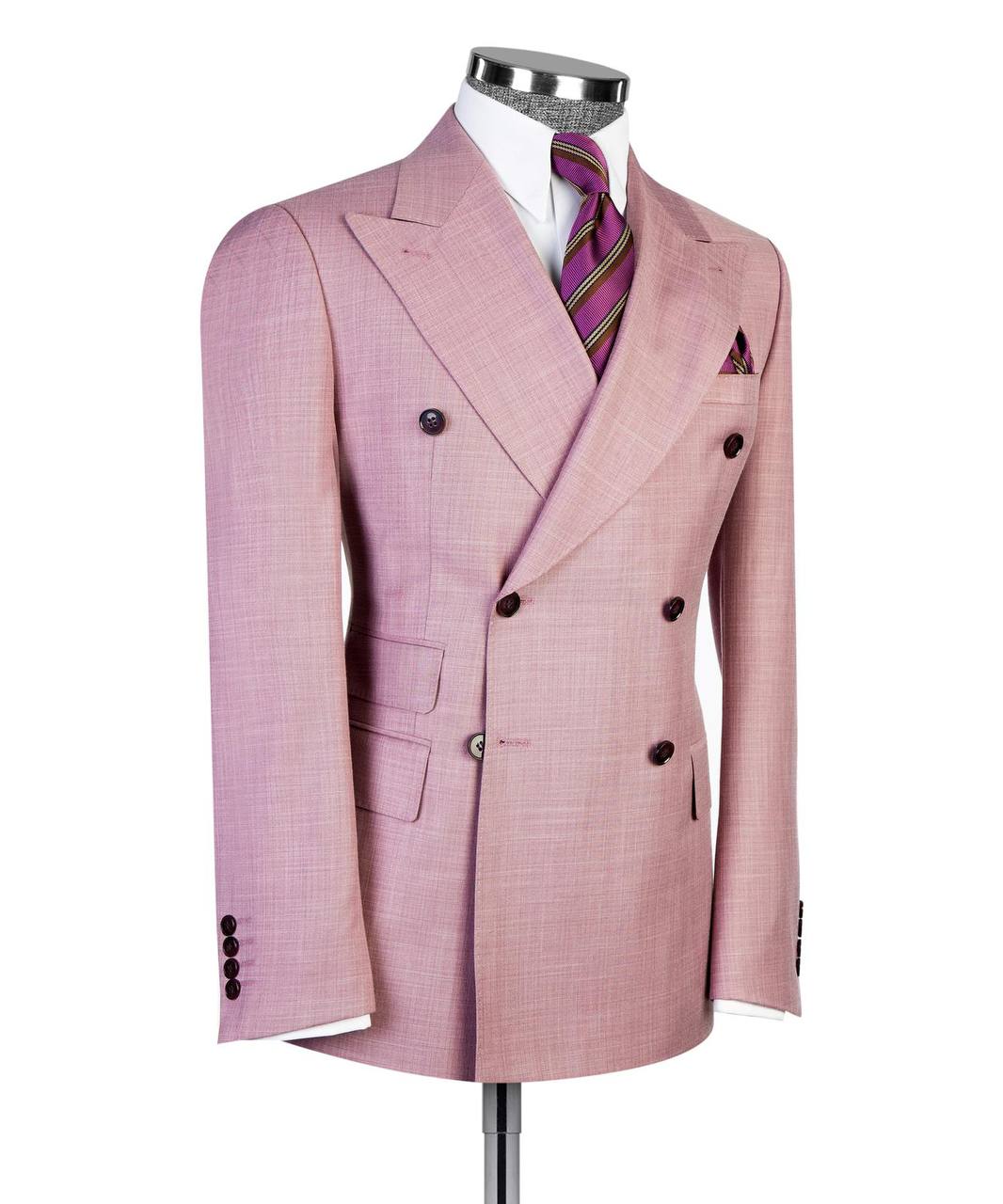 Soft pink double-breasted suit jacket tailoring and pocket detail