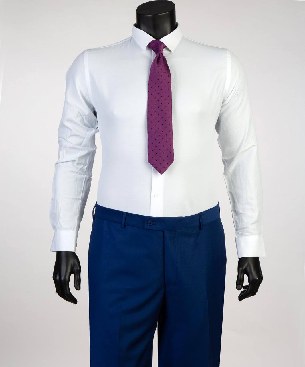 Royal blue suit trousers styled with white shirt and magenta tie
