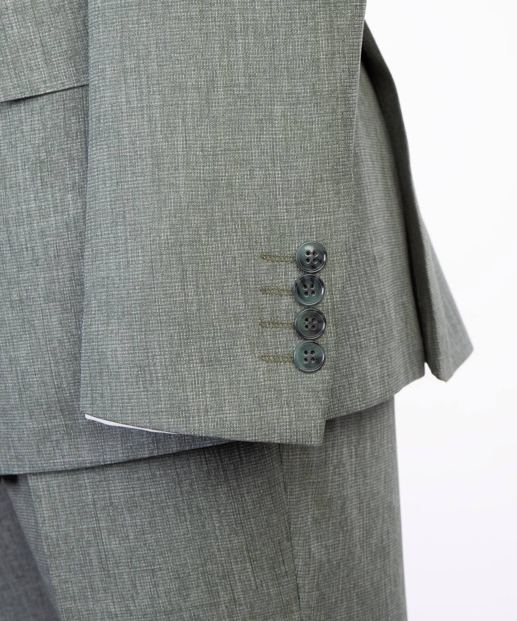 Light gray suit sleeve cuff and button detail
