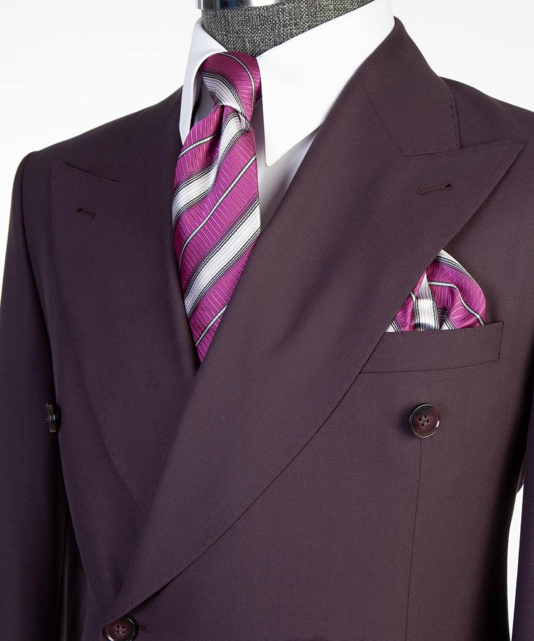 Deep plum double-breasted suit tie and pocket square close-up