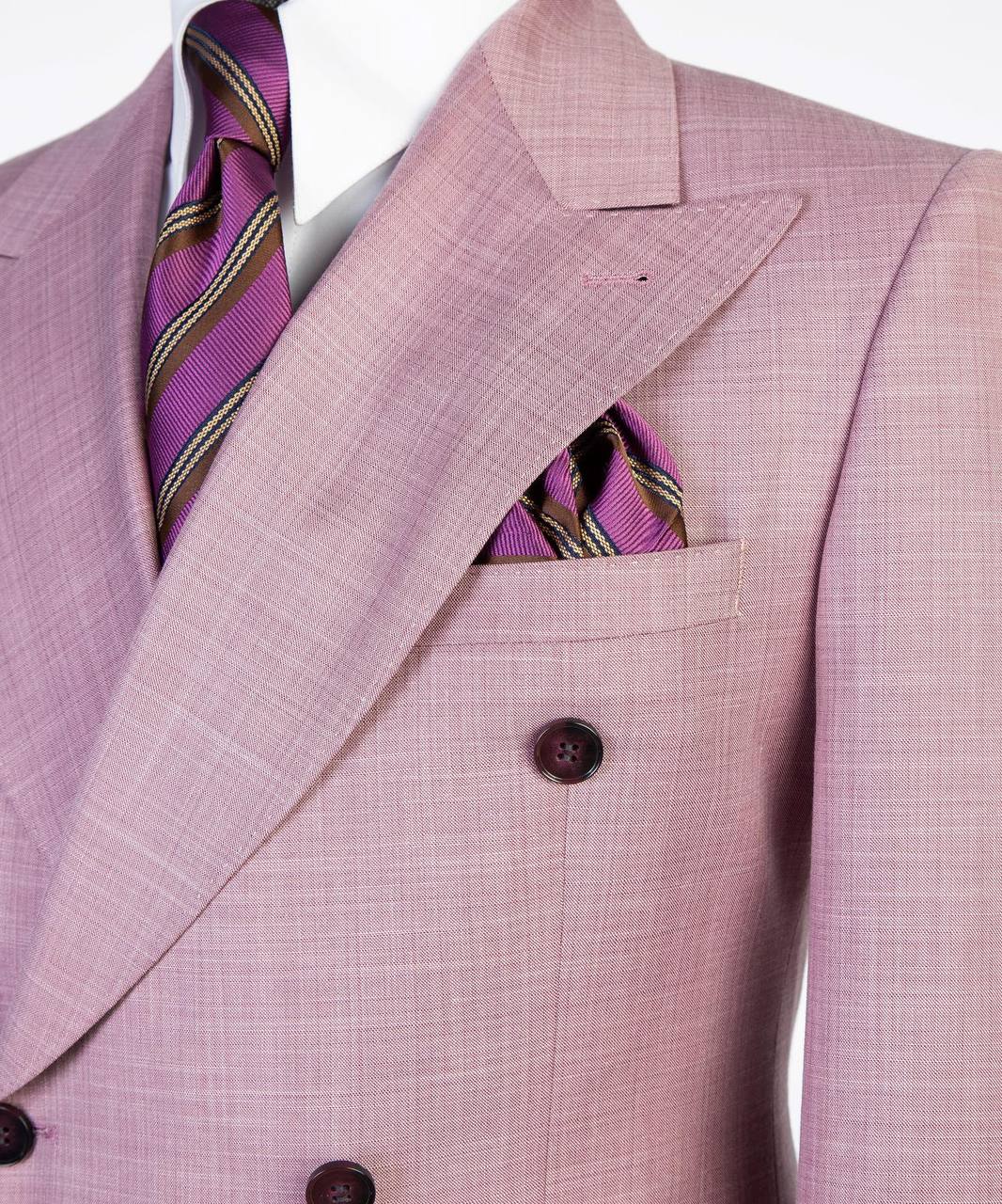 Soft pink flared-leg double-breasted suit with purple striped tie and pocket square