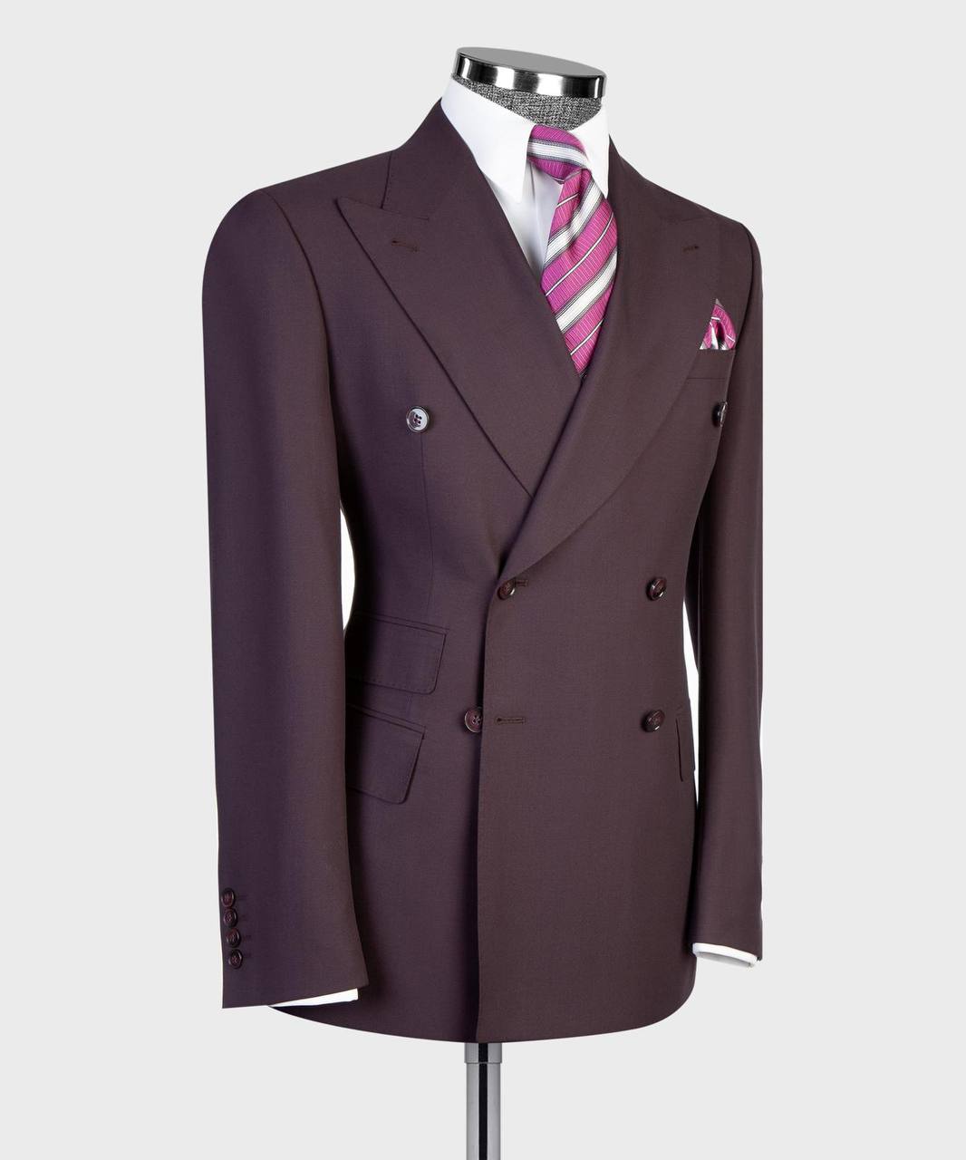 Deep plum double-breasted suit jacket tailoring and pocket detail
