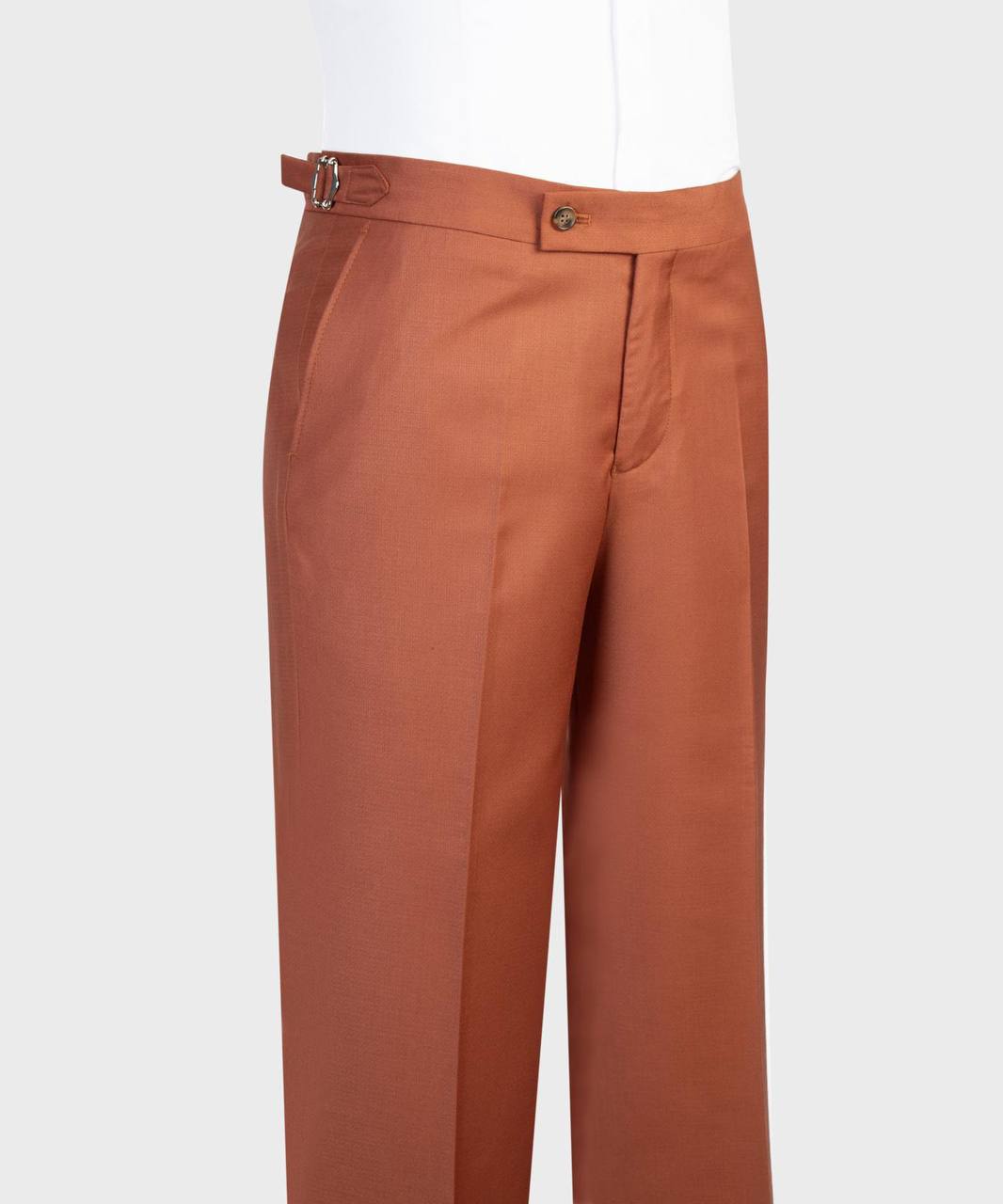 Rust orange flared-leg trouser waist and side-adjuster detail
