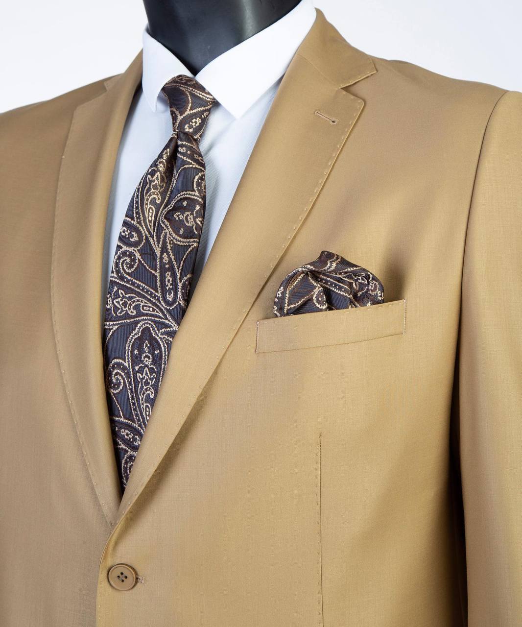 Close-up of camel tan Super 200’s wool suit jacket with paisley tie styling