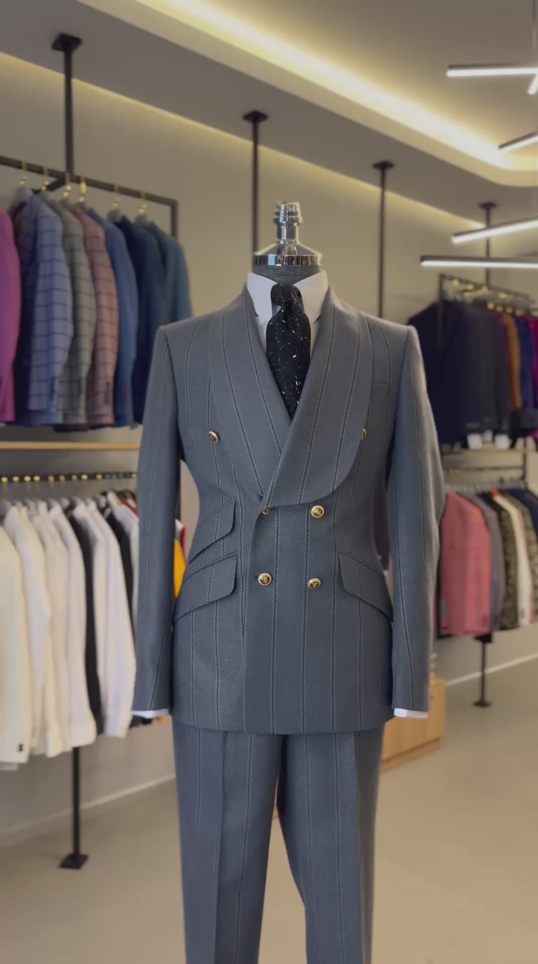 Slate blue pinstripe double-breasted suit with gold buttons from The Third Gentleman, video view